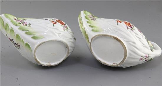 A pair of Derby leaf-moulded sauceboats, c.1758, l. 18.5cm, losses to leaves